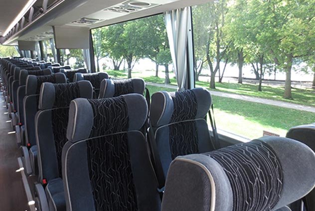 Cloth seats inside a Windstar Charter bus