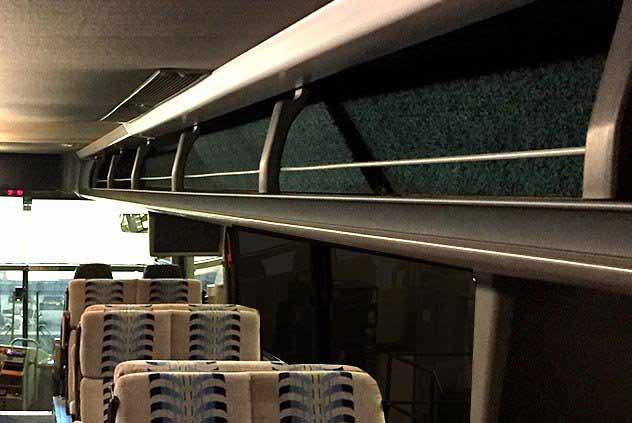 Interior of a Windstar bus with view of overhead storage compartment