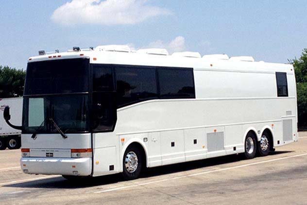 VIP Motorcoach Driving Down Road