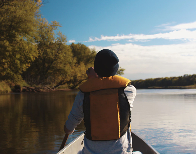 Person canoeing on a river